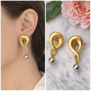 Vintage Gold Tone Post earrings with dangling silver ball. 1.5" long